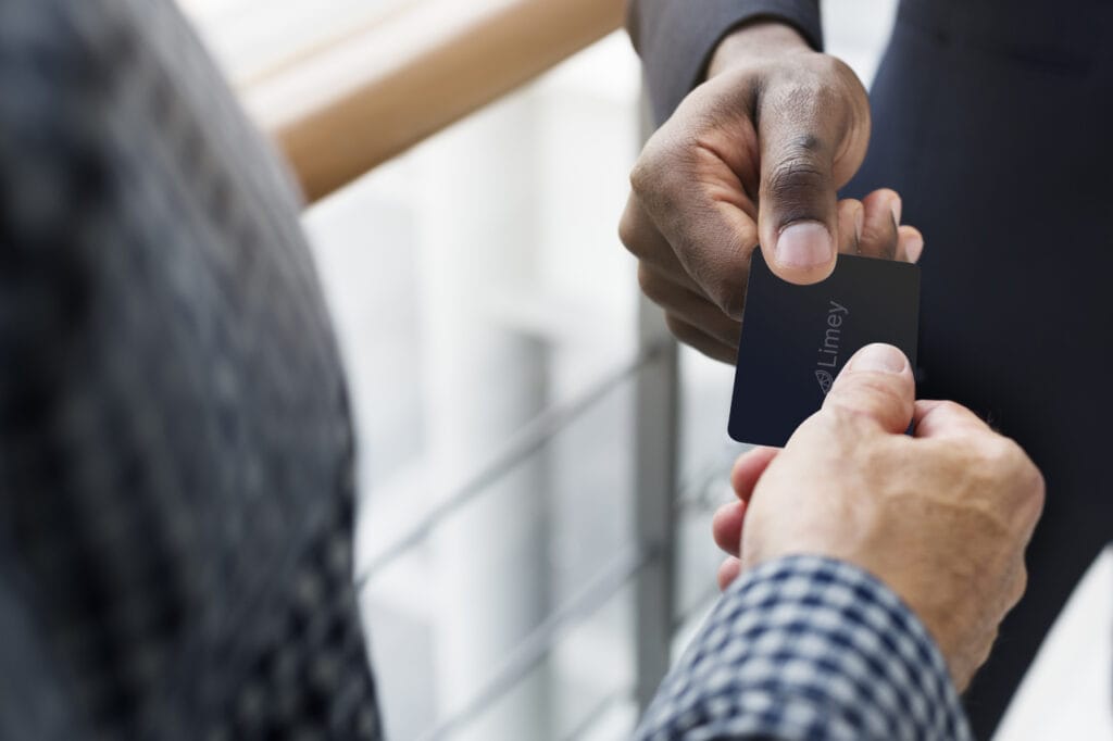 Who Should Use NFC Business Cards? A business man hands out an NFC Business Card to another business man.